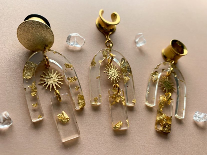 Gold Adorned Acrylic U-Shaped Earrings With Sun Pendant