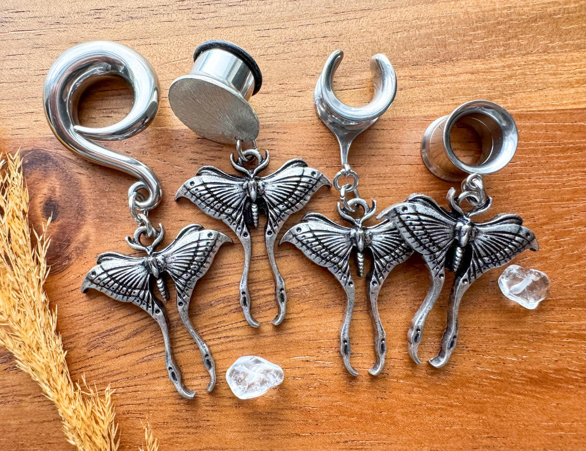 Antique silver luna moth plug earrings with detailed winged moth charms for stretched ears.