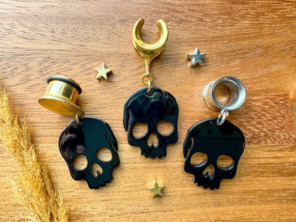 Black Shiny Skulls Plug Earrings