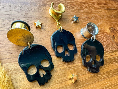 Black Shiny Skulls Plug Earrings