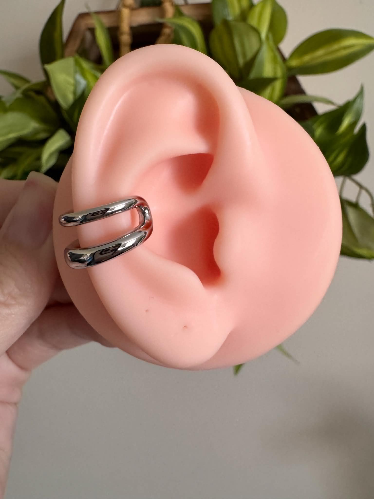 Silver double band ear cuff with a minimalist stacked design, no piercing required.