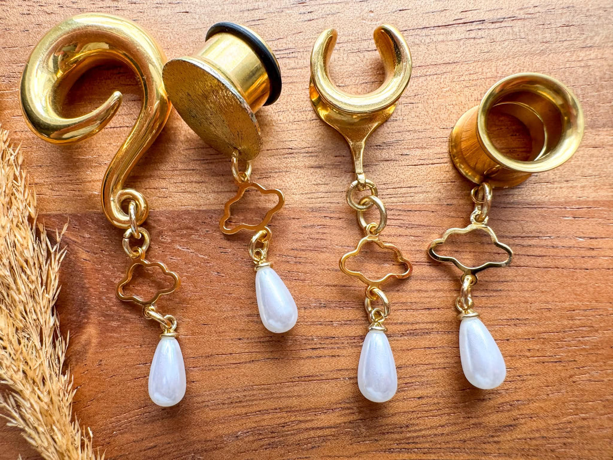 Gold Cloud Nine Pearls dangling plug earrings featuring delicate pearl accents and gold-tone details for stretched ears.
