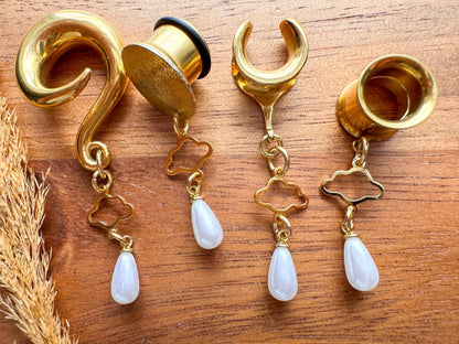 Gold Cloud Nine Pearls dangling plug earrings featuring delicate pearl accents and gold-tone details for stretched ears.