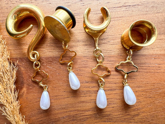 Gold Cloud Nine Pearls dangling plug earrings featuring delicate pearl accents and gold-tone details for stretched ears.