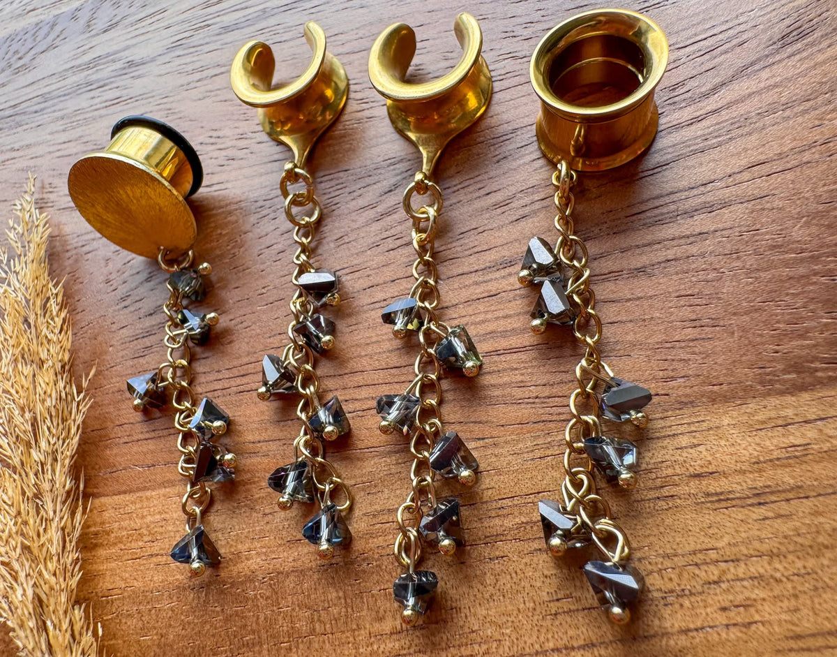 Gold smoky crystal plug earrings with cascading faceted crystal beads and dangling chains for stretched ears.