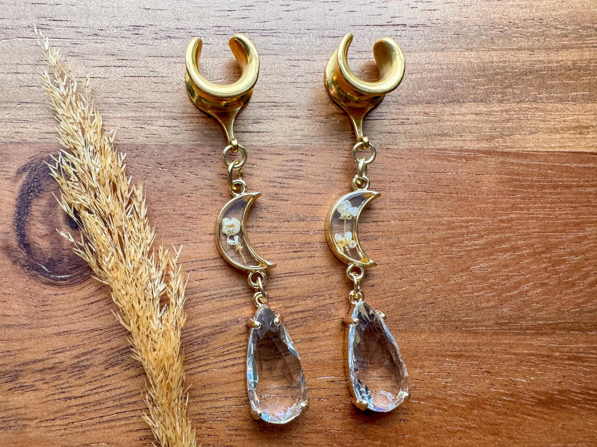 Gold floral moon plug earrings with crescent moon and botanical details for stretched ears.