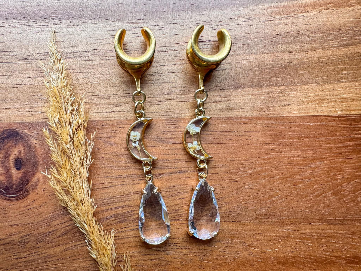 Gold floral moon plug earrings with crescent moon and botanical details for stretched ears.