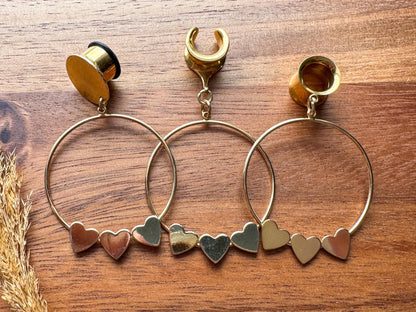 Gold Hearts in a Row hoop plug earrings featuring a row of romantic heart-shaped details in warm gold tones for stretched ears.
