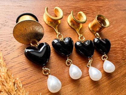 Gold black heart plug earrings with glossy heart charms and dangling white faux pearls for stretched ears.