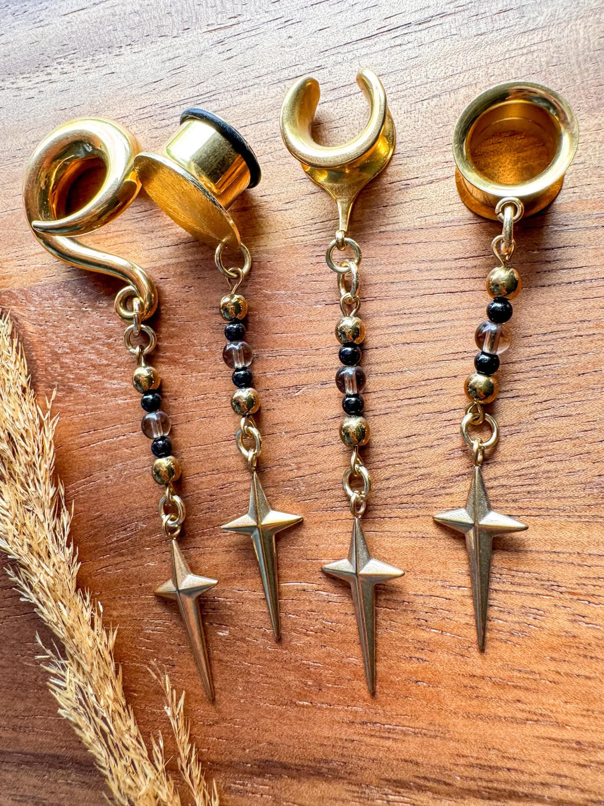 Gold Stardust & Shadows celestial-inspired dangling plug earrings for stretched ears.