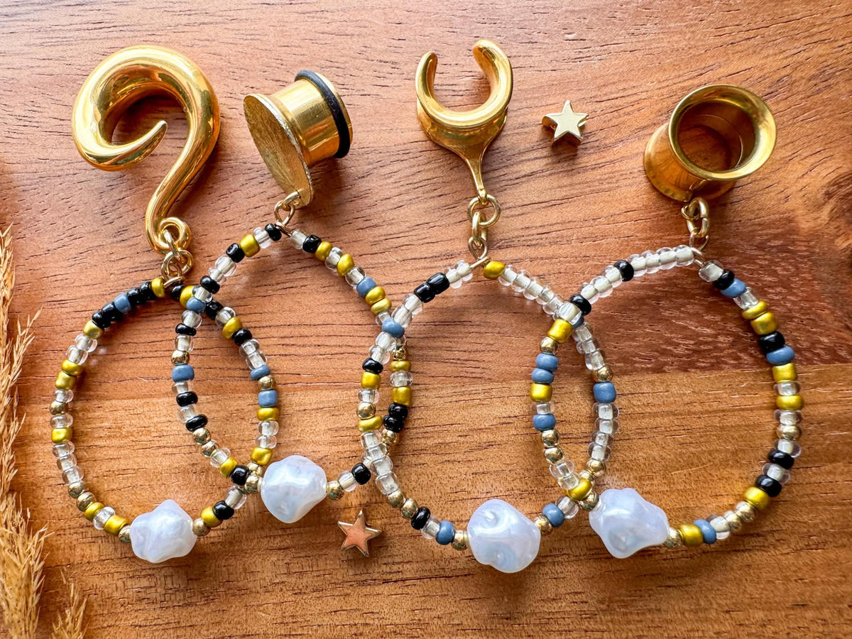 Golden boho pearl hoop plug earrings with faux pearl details for stretched ears.