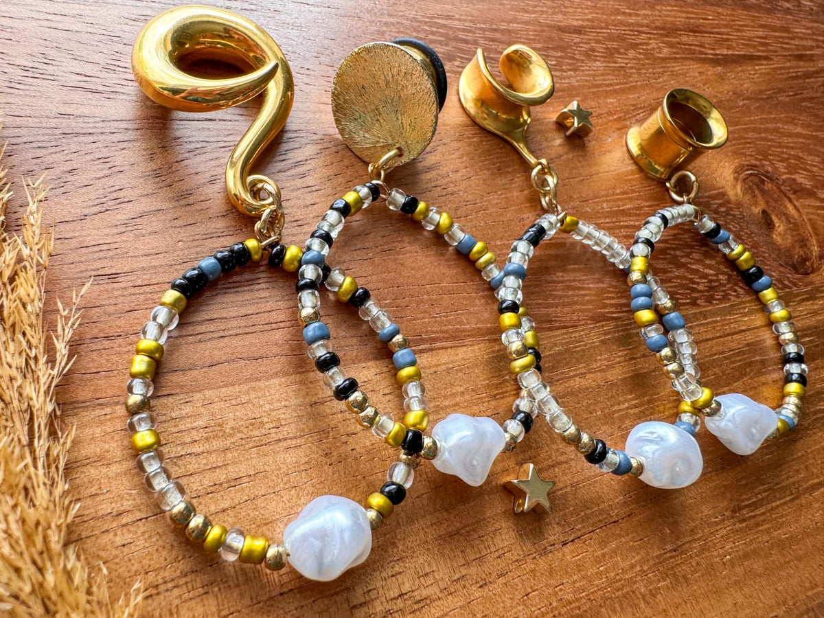 Golden boho pearl hoop plug earrings with faux pearl details for stretched ears.