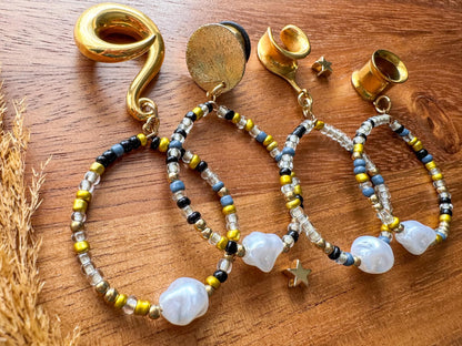 Golden boho pearl hoop plug earrings with faux pearl details for stretched ears.