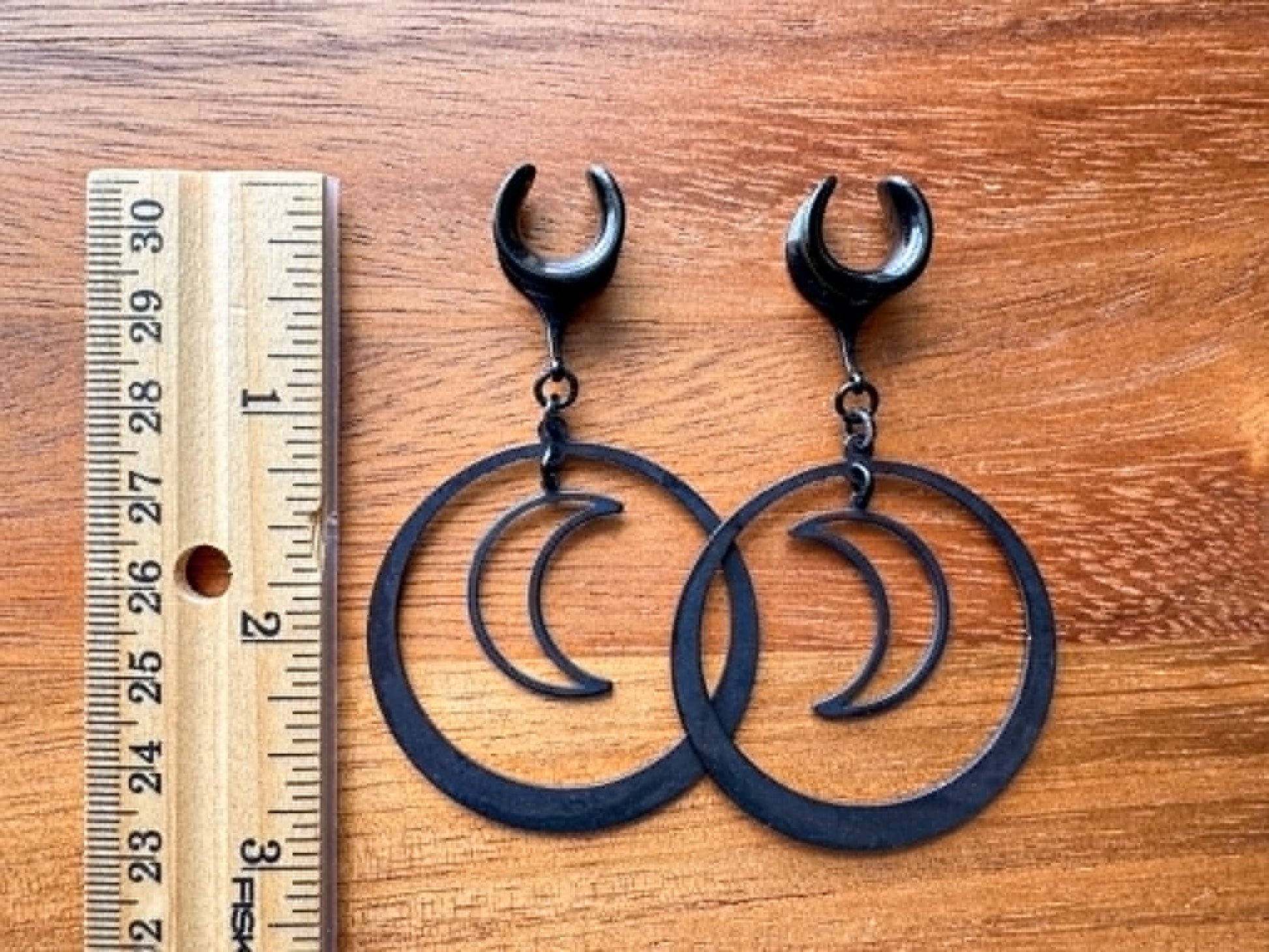 Midnight Eclipse black crescent moon hoop plug earrings for stretched ears
