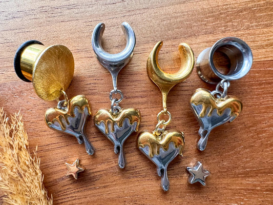 Mixed metal melting heart plug earrings with silver and gold dripping heart charms for stretched ears.