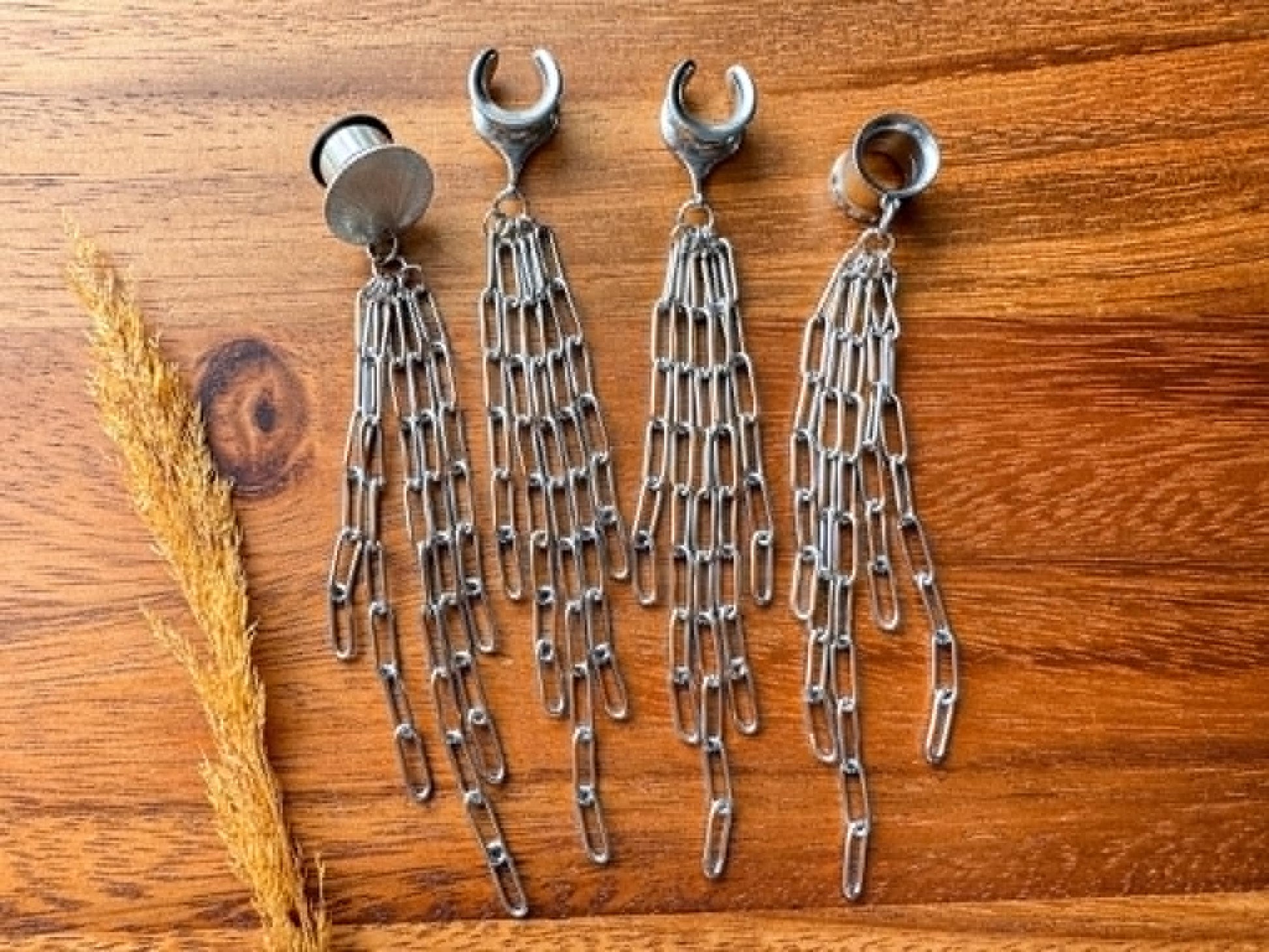 Silver chain plug earrings with long dangling chain accents for stretched ears.