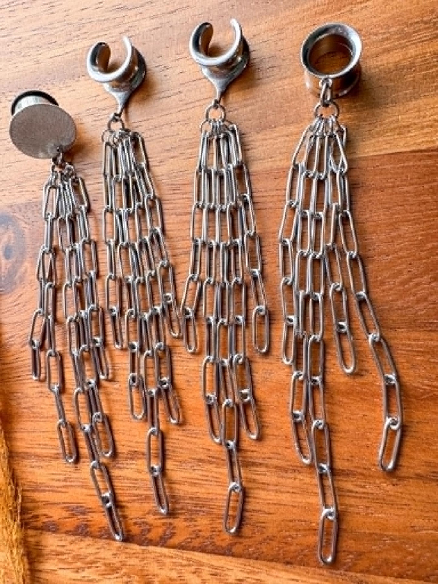 Silver chain plug earrings with long dangling chain accents for stretched ears.