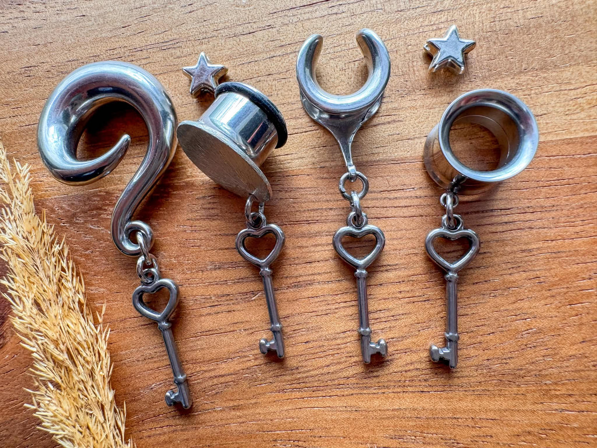 Silver Key to My Heart dangling plug earrings featuring romantic heart and key charms with vintage-inspired silver-tone details for stretched ears.