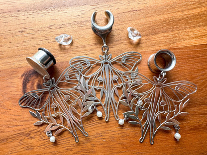 Silver moth plug earrings with whimsical woodland-inspired details for stretched ears.