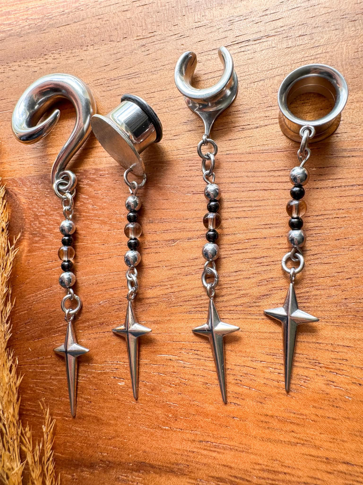 Silver Stardust & Shadows celestial-inspired dangling plug earrings for stretched ears.