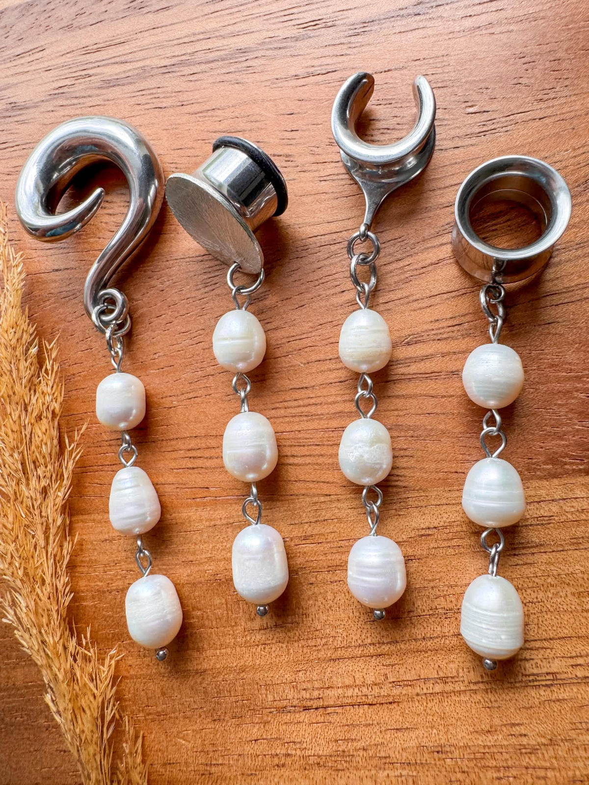 Silver pearl plug earrings with three cascading white pearl beads for stretched ears.