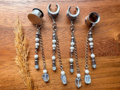 Silver ocean inspired plug earrings with dangling seaside details for stretched ears.
