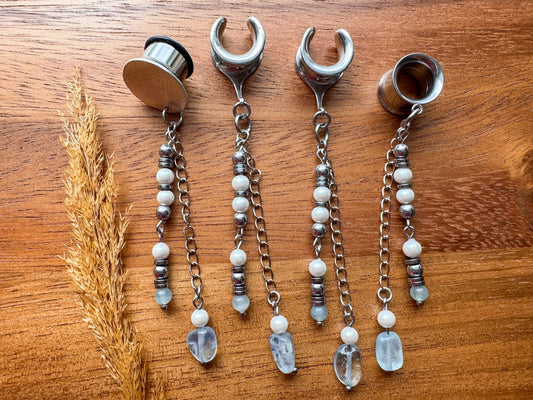 Silver ocean inspired plug earrings with dangling seaside details for stretched ears.