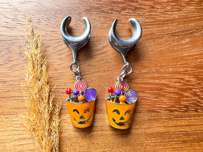 Silver Halloween treat basket plug earrings with dangling candy basket charms for stretched ears.