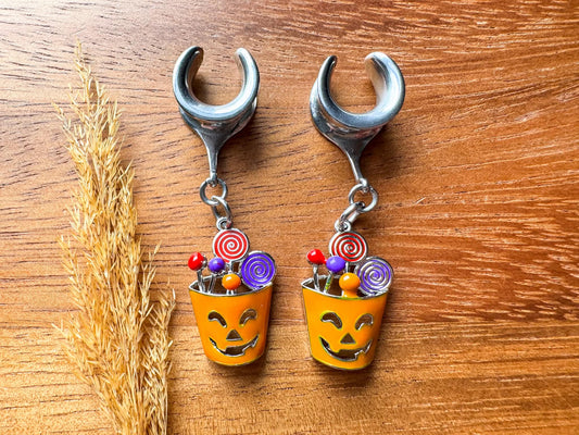 Silver Halloween treat basket plug earrings with dangling candy basket charms for stretched ears.