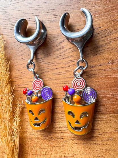 Silver Halloween treat basket plug earrings with dangling candy basket charms for stretched ears.