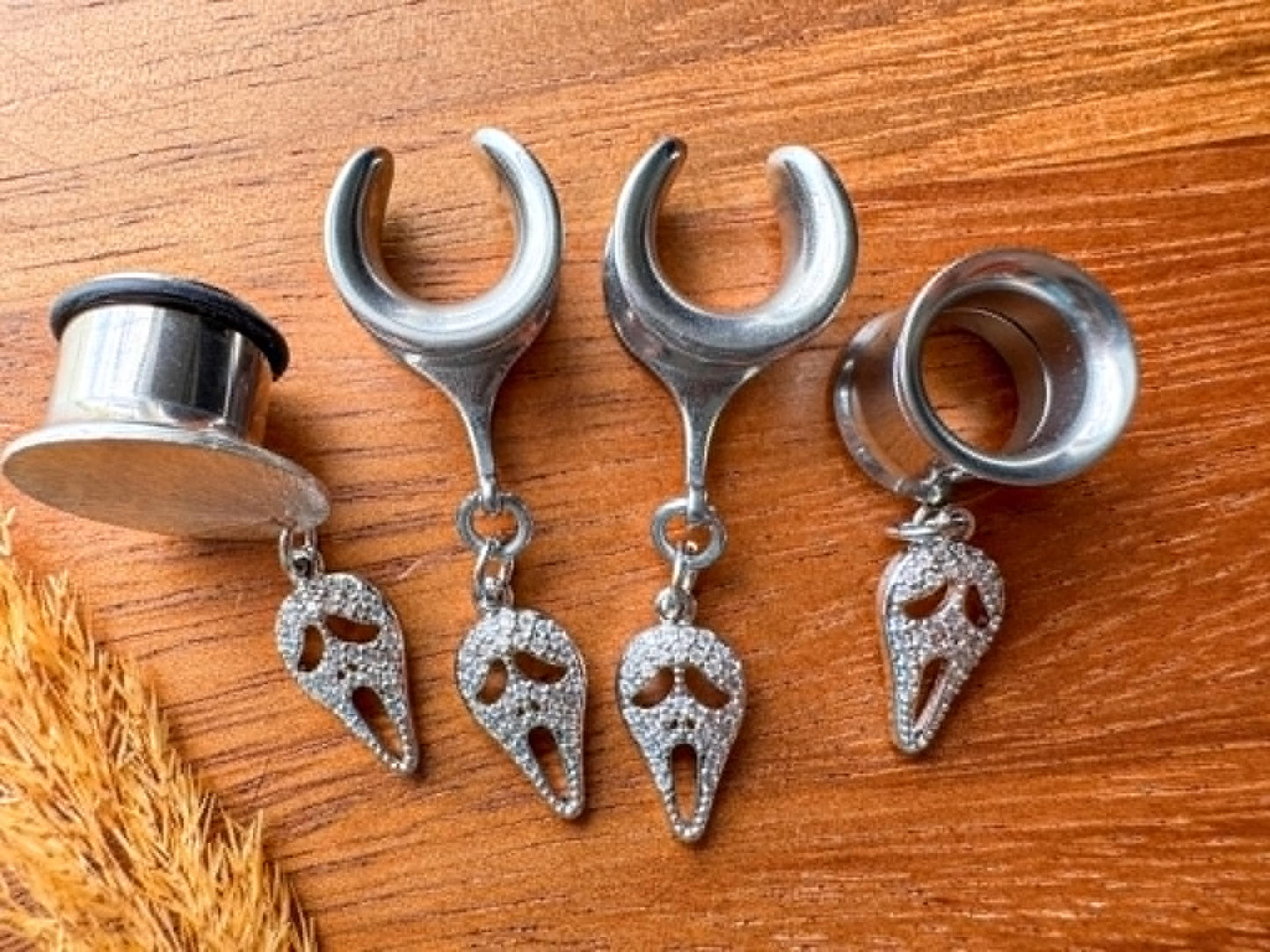 Silver zircon Halloween mask plug earrings with sparkling masquerade mask charms for stretched ears.