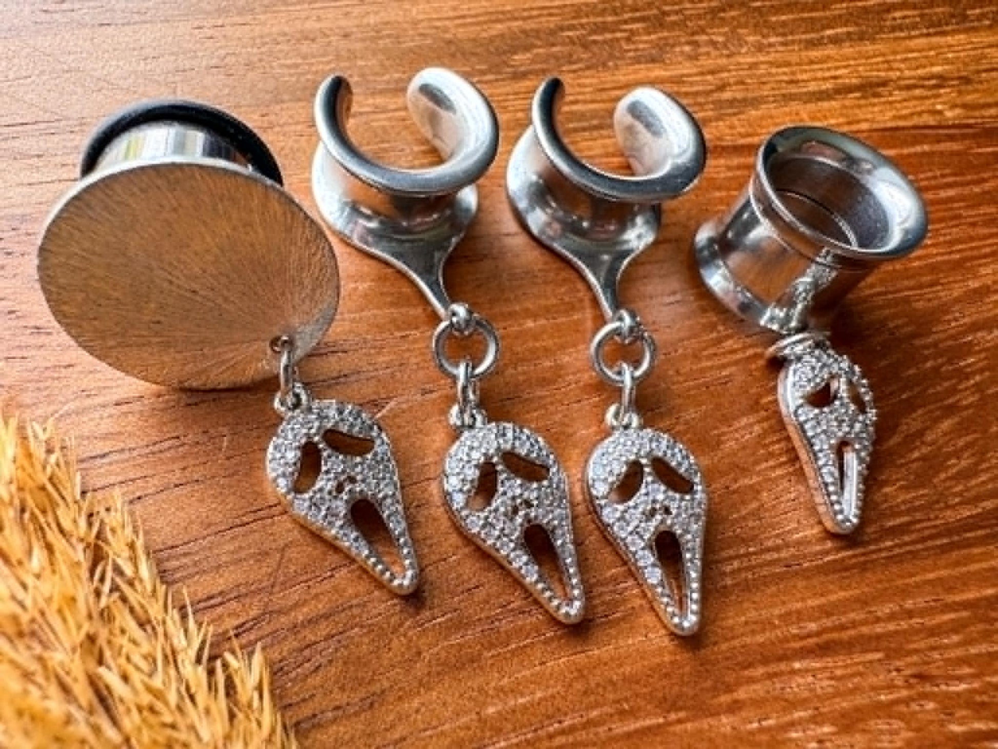 Silver zircon Halloween mask plug earrings with sparkling masquerade mask charms for stretched ears.
