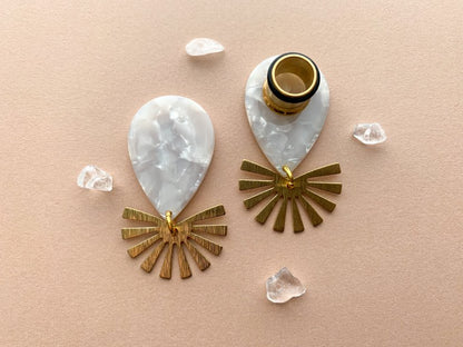 White Marble Acetate Dangle With Gold Brushed Sunburst