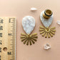 White Marble Acetate Dangle With Gold Brushed Sunburst
