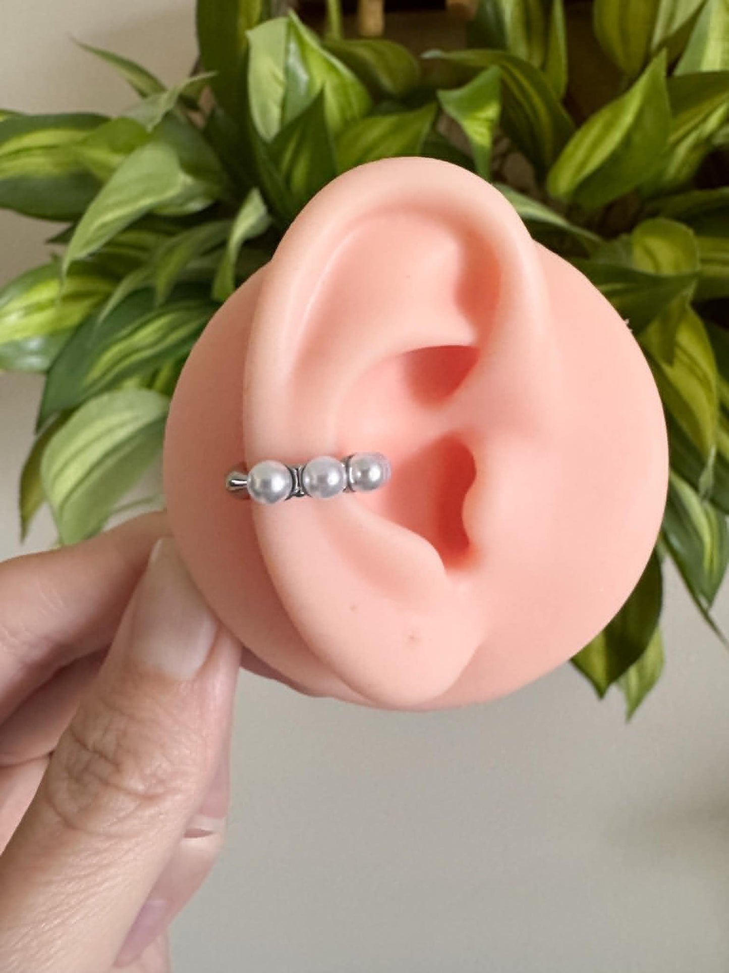 Silver faux pearl ear cuff with four pearl detail